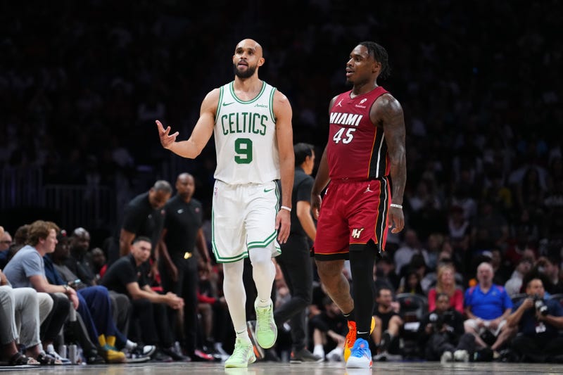 Derrick White #9 of the Boston Celtics reacts after scoring a three-pointer against Davion Mitchell #45 of the Miami Heat during the fourth quarter at Kaseya Center on March 14, 2025 in Miami, Florida.