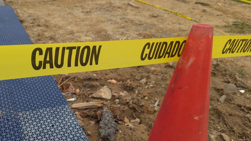 Caution tape across cone 