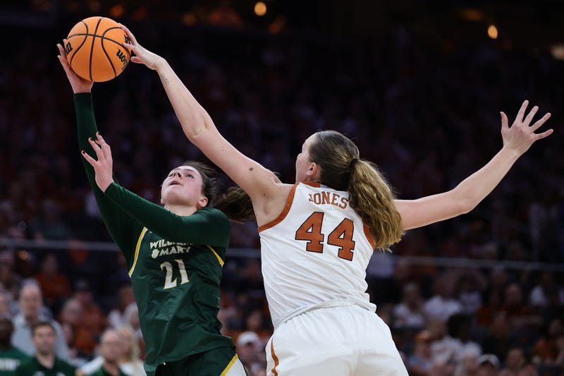 Taylor Jones #44 of the Texas Longhorns blocks a shot from Natalie Fox #21 of the William & Mary Tribe during the second half in the first round of the NCAA Women's Basketball Tournament at Moody Center on March 22, 2025, in Austin, Texas.