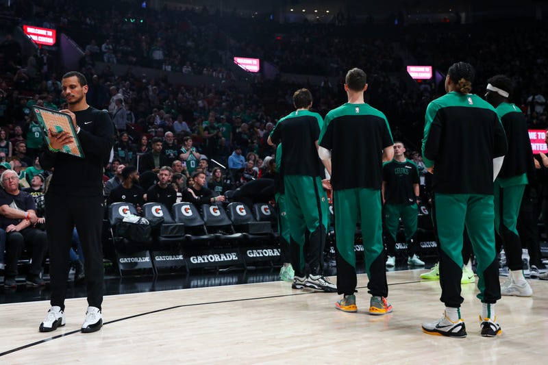 Head Coach Joe Mazzulla of the Boston Celtics (L) looks on during player introductions before a game against the Portland Trail Blazers at the Moda Center on March 23, 2025 in Portland, Oregon. NOTE TO USER: User expressly acknowledges and agrees that, by downloading and or using this photograph, User is consenting to the terms and conditions of the Getty Images License Agreement.