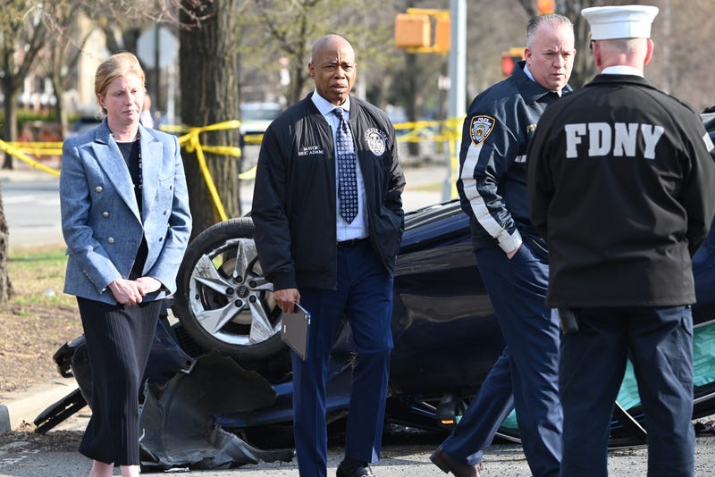 Mayor Eric Adams and police at the scene in Brooklyn where a mother and two children were killed, allegedly by an Audi driver with a suspended license, on March 29, 2025