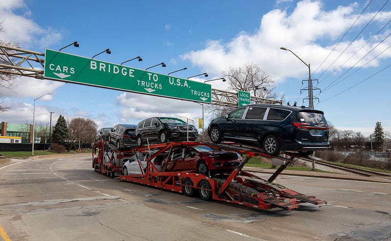 A car hauler truck makes its way to the Ambassador Bridge to cross into the United States at Detroit on April 1, 2025 in Windsor, Canada.