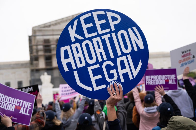 A pro-choice demonstrator holds a sign in front of the U.S. Supreme Court as the Medina v. Planned Parenthood South Atlantic case is heard on Wednesday, April 2, 2025.