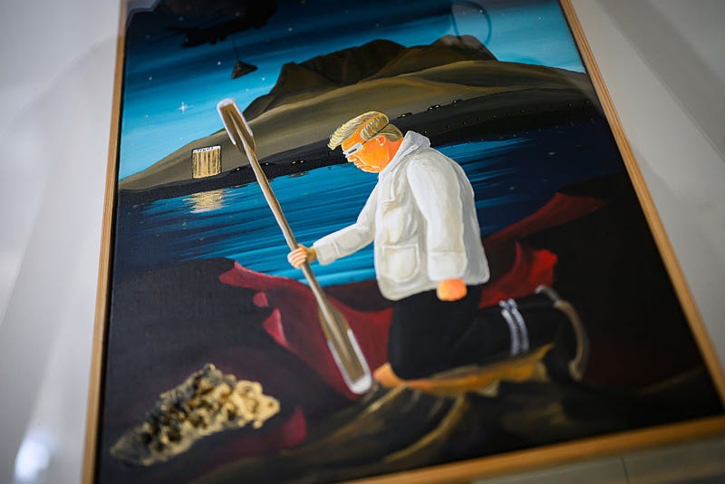 An artwork titled "Trump" by Greenlandic artist Kristian "Keto" Christiansen, depicting President of the United States Donald Trump wearing traditional Greenlandic snow goggles and clothing while digging up minerals with a kayak paddle, is displayed in a glass case on March 30, 2025 in Nuuk, Greenland. 