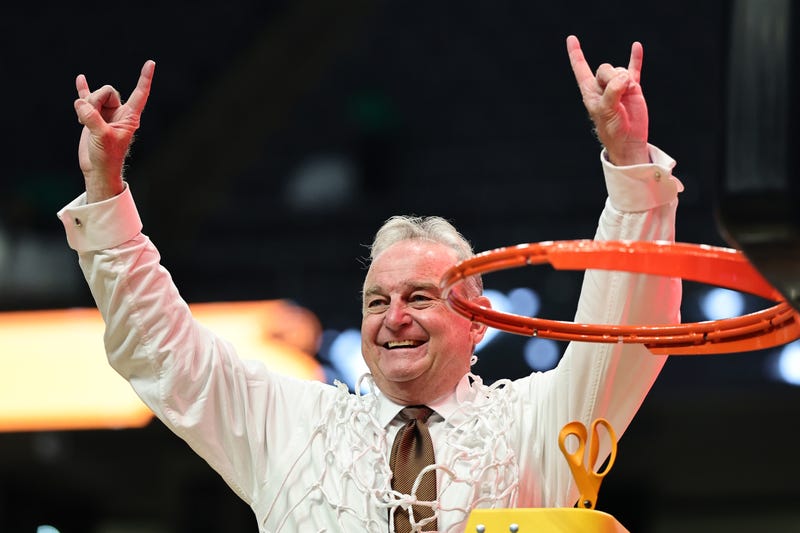 Head coach Vic Schaefer of the Texas Longhorns cuts down the net after defeating the TCU Horned Frogs 58-47 in the Elite Eight round of the NCAA Women's Basketball Tournament at Legacy Arena at the BJCC on March 31, 2025, in Birmingham, Alabama.