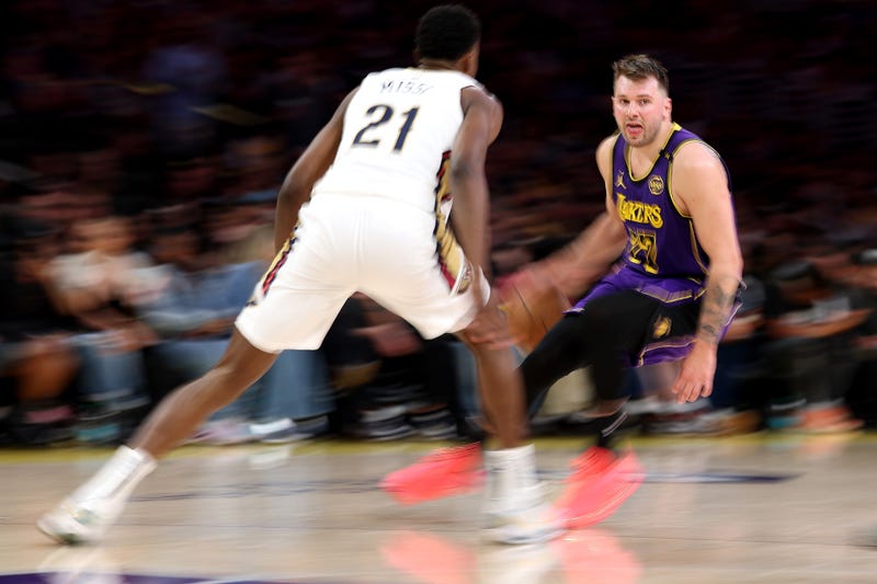 LOS ANGELES, CALIFORNIA - APRIL 04: Luka Doncic #77 of the Los Angeles Lakers dribbles the ball against Yves Missi #21 of the New Orleans Pelicans during the second quarter at Crypto.com Arena on April 04, 2025 in Los Angeles, California. NOTE TO USER: User expressly acknowledges and agrees that, by downloading and or using this photograph, user is consenting to the terms and conditions of the Getty Images License Agreement. (Photo by Luke Hales/Getty Images)
