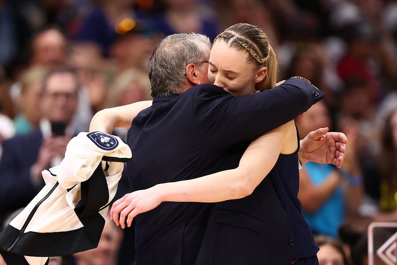 Head coach Geno Auriemma and Paige Bueckers #5 of the UConn Huskies embrace in the fourth quarter against the South Carolina Gamecocks in the National Championship of the NCAA Women's Basketball Tournament at Amalie Arena on April 06, 2025 in Tampa, Florida. 