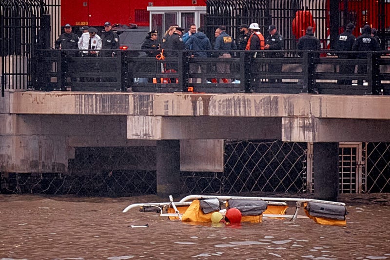 Police and firefighters work on the site after a helicopter crashed in the Hudson River on April 10, 2025 in Jersey City.