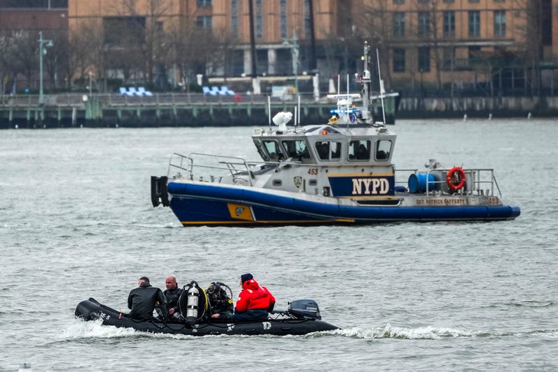 NYPD scuba Divers team search next to the site of a crashed helicopter on the Hudson River on April 11, 2025