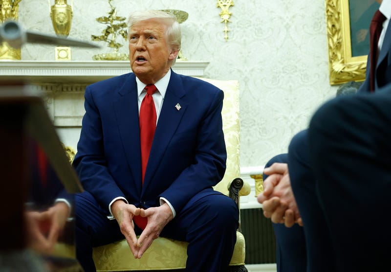 President Donald Trump answers a reporters question in the Oval Office of the White House on April 7, 2025