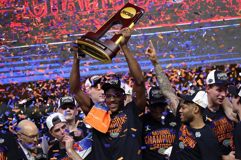 Rueben Chinyelu #9 of the Florida Gators celebrates with the trophy after defeating the Houston Cougars in the National Championship of the NCAA Men's Basketball Tournament at the Alamodome on April 07, 2025 in San Antonio, Texas.