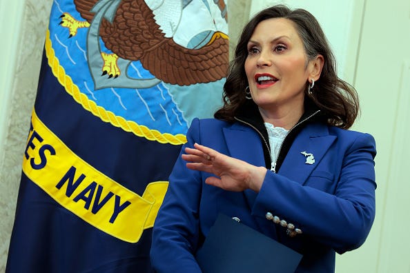Michigan Governor Whitmer stands in the Oval Office during a visit to the White House