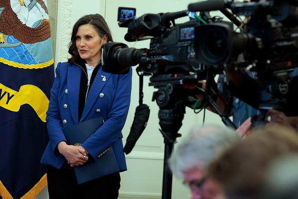 Michigan Gov. Gretchen Whitmer speaks as U.S. President Donald Trump signs executive orders in the Oval Office of the White House on April 09, 2025 in Washington, DC.
