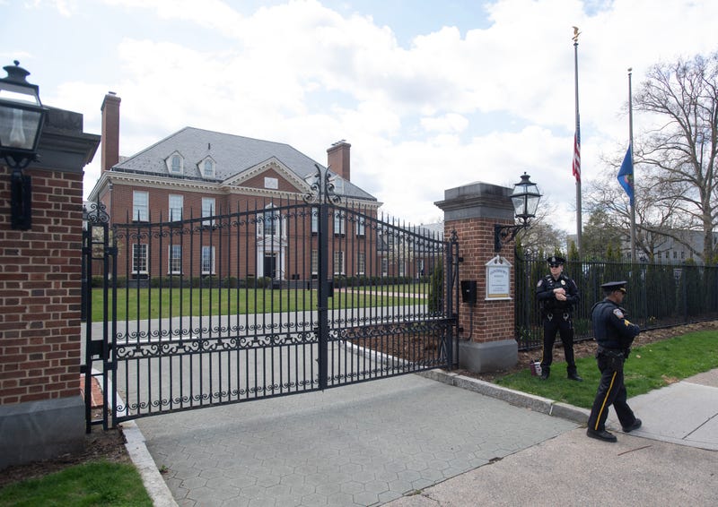Police stand in front of the Pennsylvania governor's mansion after a portion of the property was damaged in an arson fire overnight on April 13, 2025, in Harrisburg, Pennsylvania. 