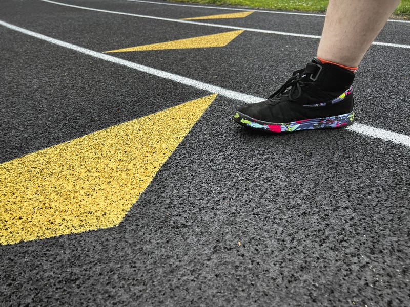 Person on a high school track 