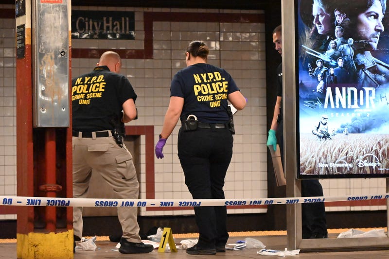 Police officers investigate the scene after a 38-year-old man was fatally stabbed at the Brooklyn Bridge-City Hall subway station in Manhattan, New York, United States, on April 25, 2025
