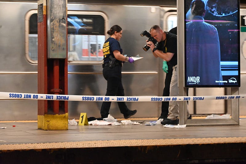 Police officers investigate the scene after a 38-year-old man was fatally stabbed at the Brooklyn Bridge-City Hall subway station in Manhattan on April 25, 2025.