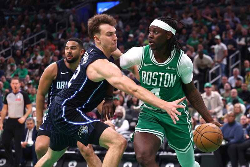 Jrue Holiday #4 of the Boston Celtics dribbles the ball as Franz Wagner #22 of the Orlando Magic defends during the third quarter in Game Two of the Eastern Conference First Round NBA Playoffs at TD Garden on April 23, 2025 in Boston, Massachusetts.