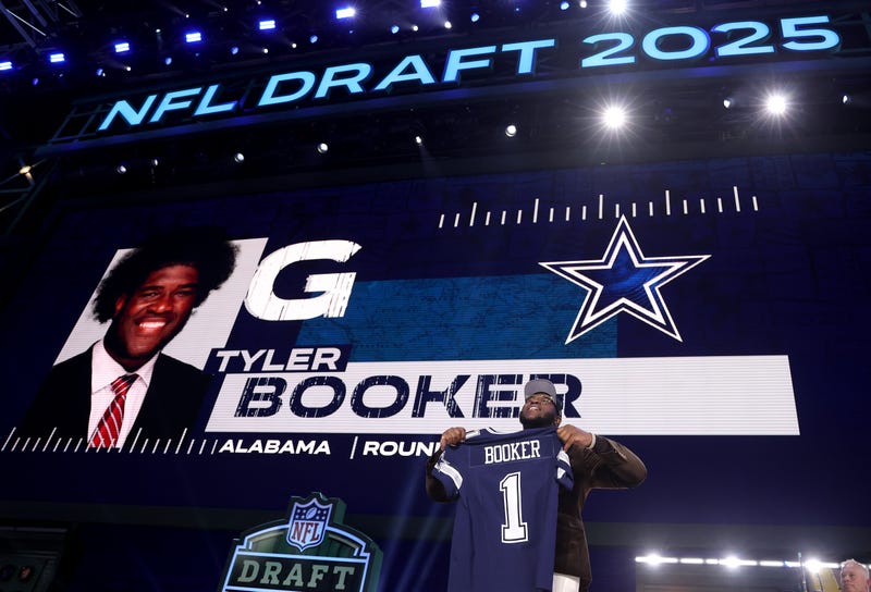GREEN BAY, WISCONSIN - APRIL 24: Guard Tyler Booker of Alabama celebrates after being selected twelfth overall pick by the Dallas Cowboys during the first round of the 2025 NFL Draft at Lambeau Field on April 24, 2025 in Green Bay, Wisconsin. (Photo by Stacy Revere/Getty Images)
