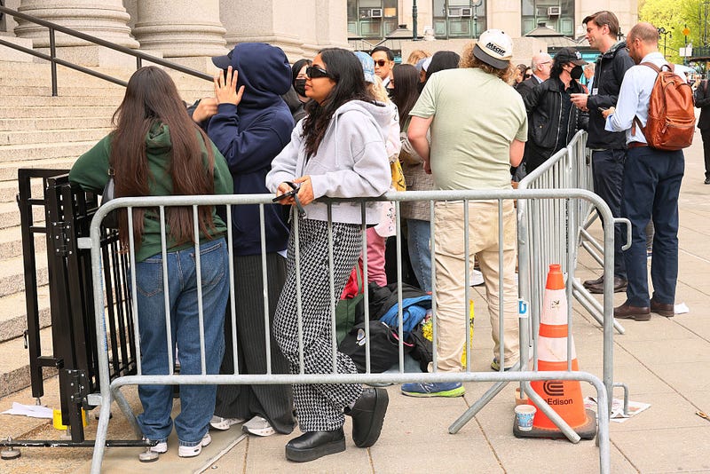 People wait to enter Federal Court for an arraignment hearing for Luigi Mangione, accused gunman in the killing of UnitedHealthcare CEO Brian Thompson, on April 25, 2025 in New York City. 