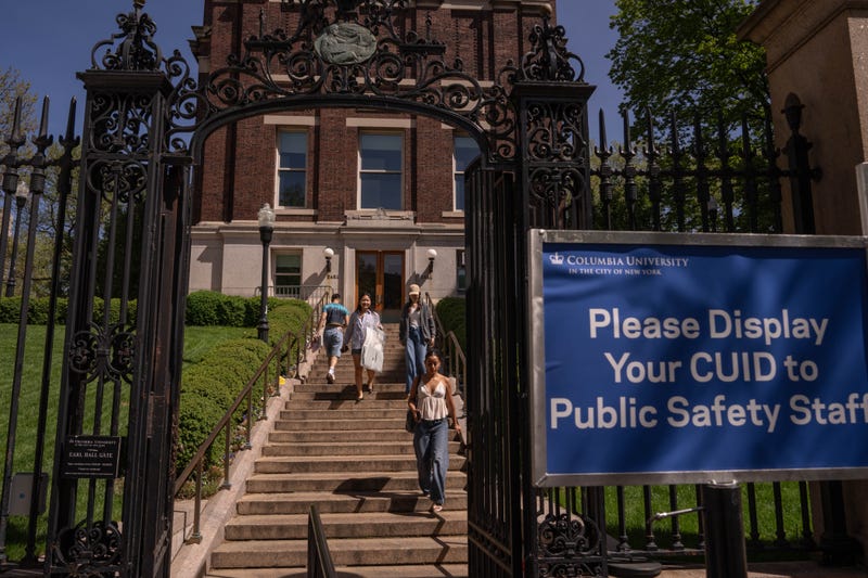 People use an entrance and exit at Columbia University on April 30, 2025
