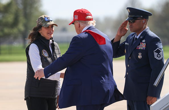 Michigan Gov. Gretchen Whitmer greets President Donald Trump after he arrived on Air Force One to speak to Air National Guard troops on April 29, 2025 at Selfridge Air National Guard Base, Michigan