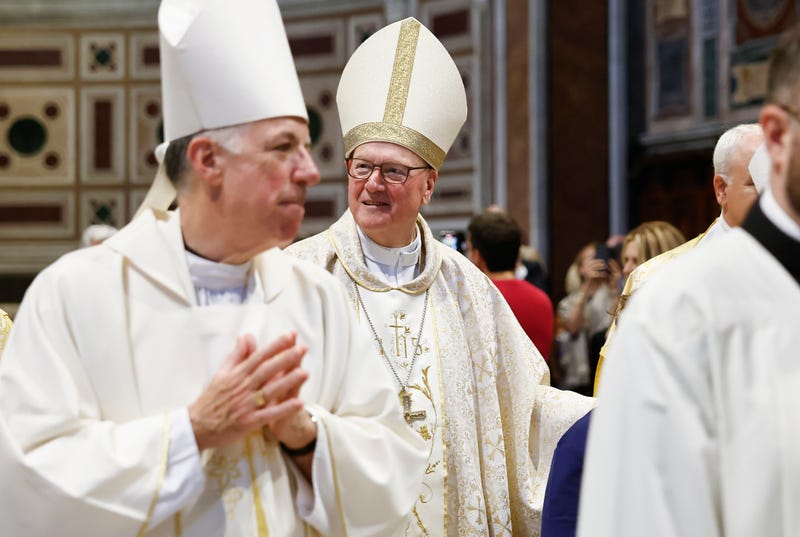 Cardinal Timothy Dolan (C) departs after leading a Mass in Basilica of Saint John Lateran on May 2, 2025 in Rome, Italy