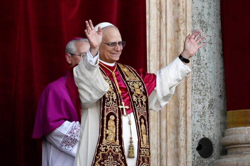 Pope Leo XIV greets those cheering his election from the loggia in The Vatican on May 8, 2025.