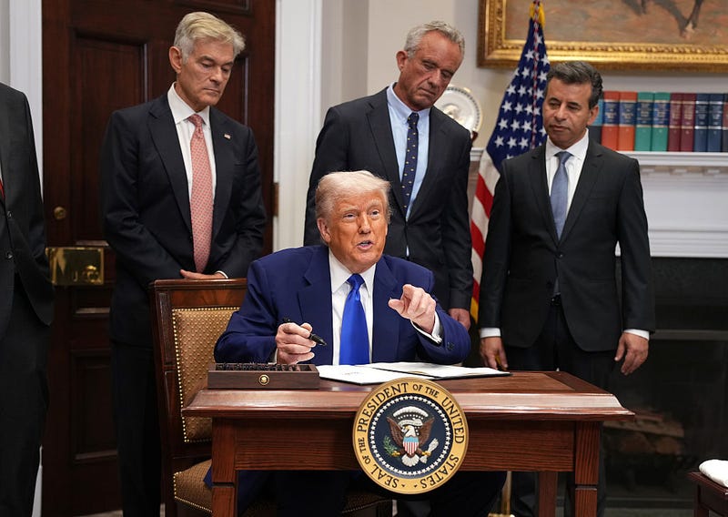 President Donald Trump signs an executive order aimed at reducing the cost of prescription drugs and pharmaceuticals by 30% to 80% during an event in the Roosevelt Room of the White House on May 12, 2025, in Washington, DC. 