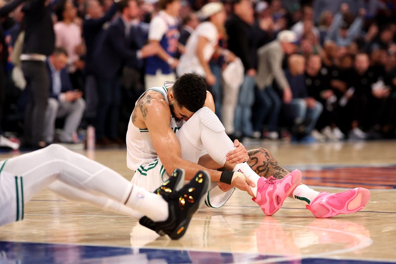 Jayson Tatum #0 of the Boston Celtics holds his ankle on the ground after being injured against the New York Knicks during the fourth quarter in Game Four of the Eastern Conference Second Round NBA Playoffs at Madison Square Garden on May 12, 2025 in New York City.