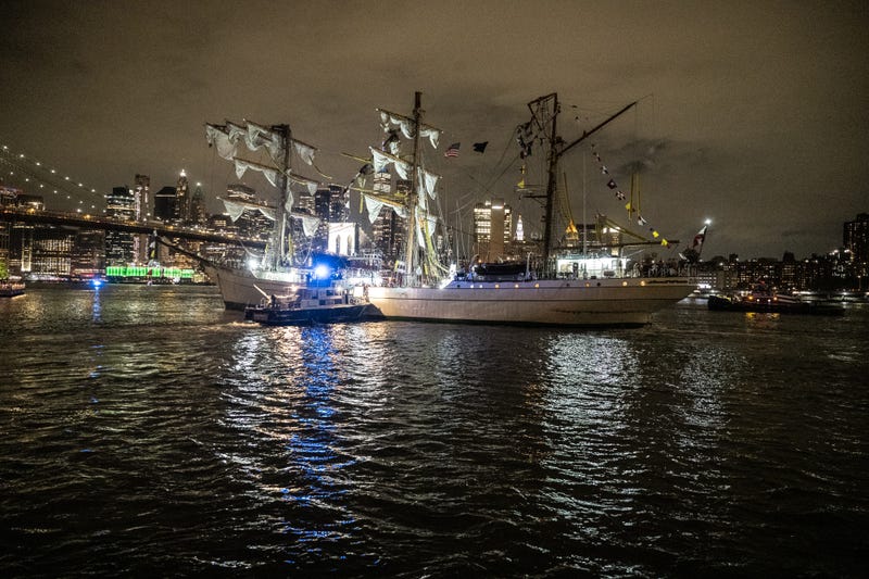 A disabled Mexican Navy tall ship floats between the Brooklyn and the Manhattan bridges on the East River on May 17, 2025