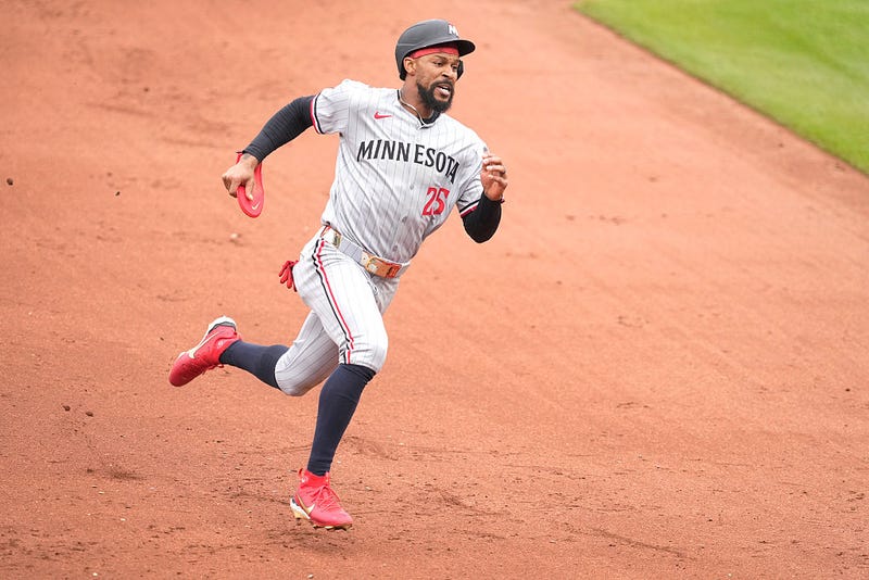 Byron Buxton #25 of the Minnesota Twins scores on a double by Trevor Larnach #9 in the ninth inning during game one of a doubleheader against the Baltimore Orioles at Oriole Park at Camden Yards on May 14, 2025 in Baltimore, Maryland.