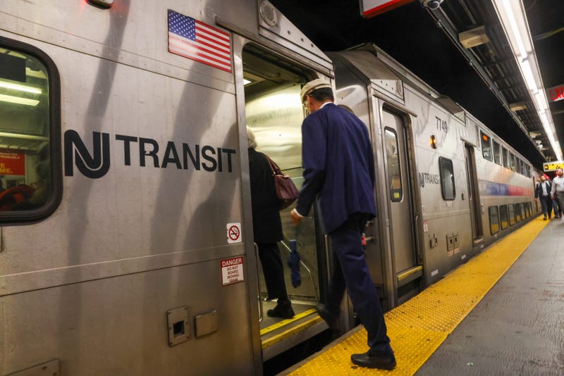 People board a New Jersey Transit train in Manhattan on May 15, 2025 in New York City