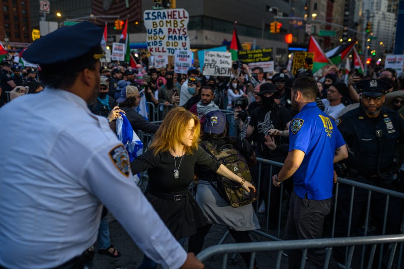 NYPD officers separate pro-Israel and pro-Palestinian protesters during protests in Union Square on May 15, 2025.