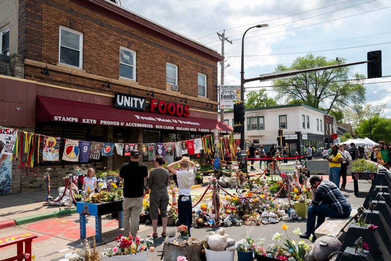 People gather at the site where George Floyd was killed during the Rise and Remember event at George Floyd Square on May 25, 2025 in Minneapolis, Minnesota.