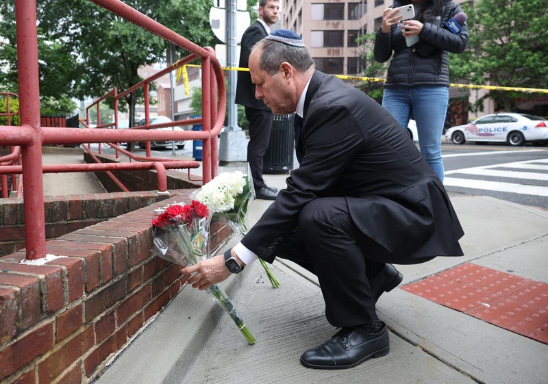 Israeli Minister of Industry Nir Barkat leaves flowers at the Lillian and Albert Small Capital Jewish Museum on May 22, 2025, in Washington, D.C.