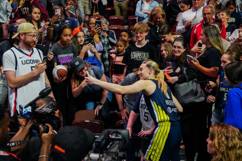 UConn great Paige Bueckers poses with fans at Mohegan Sun after she picked up her first win as a professional. She scored 21 points as her Dallas Wings beat the Connecticut Sun, 109-87.
