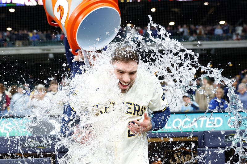 Caleb Durbin #21 of the Milwaukee Brewers has water dumped on him after his game winning sacrifice fly in the 10th inning against the Boston Red Sox at American Family Field on May 28, 2025 in Milwaukee, Wisconsin