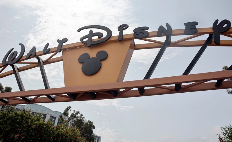  The Disney logo is displayed at Walt Disney Studios on June 3, 2025 in Burbank, California. Walt Disney Co. announced it is laying off hundreds of employees worldwide from several divisions including film and television. 