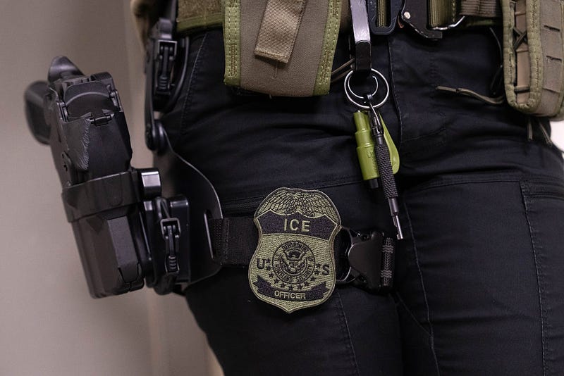 An Immigration and Customs Enforcement (ICE) agent stands outside of immigration court hearings, at Jacob K. Javits Federal Building on June 10, 2025 in New York City. 
