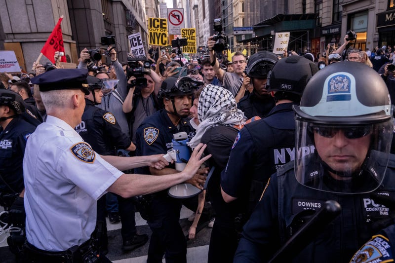 NYPD officers arrest a demonstrator during an anti-ICE protest outside 26 Federal Plaza Building on June 10, 2025