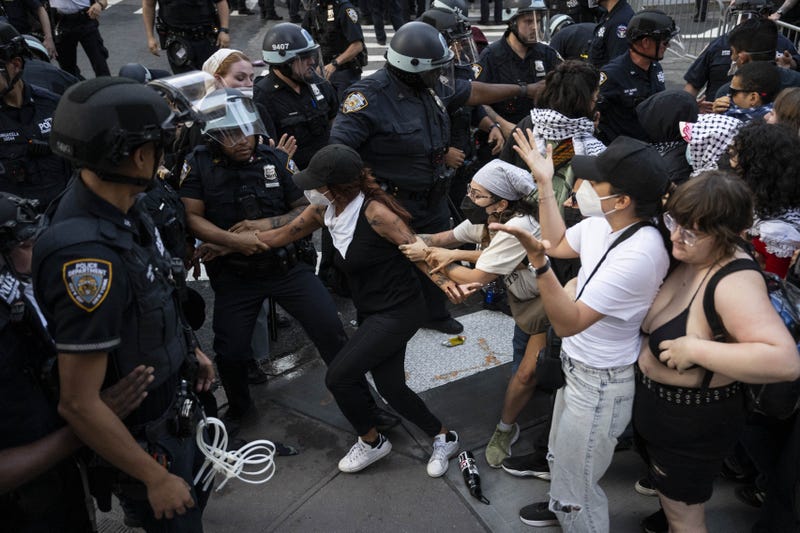 NYPD officers arrest a demonstrator during an anti-ICE protest outside 26 Federal Plaza Building on June 10, 2025
