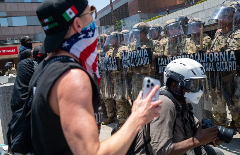 LOS ANGELES, CALIFORNIA - JUNE 08: The National Guard and protesters stand off outside of a downtown jail in Los Angeles following two days of clashes with police during a series of immigration raids on June 08, 2025 in Los Angeles, California. Tensions in the city remain high after the Trump administration called in the National Guard against the wishes of city leaders.