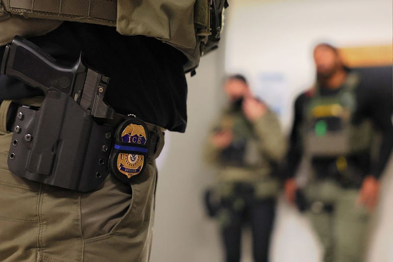 An ICE officers badge is seen as federal agents patrol the halls of immigration court at the Jacob K. Javitz Federal Building on June 10, 2025 in New York City.