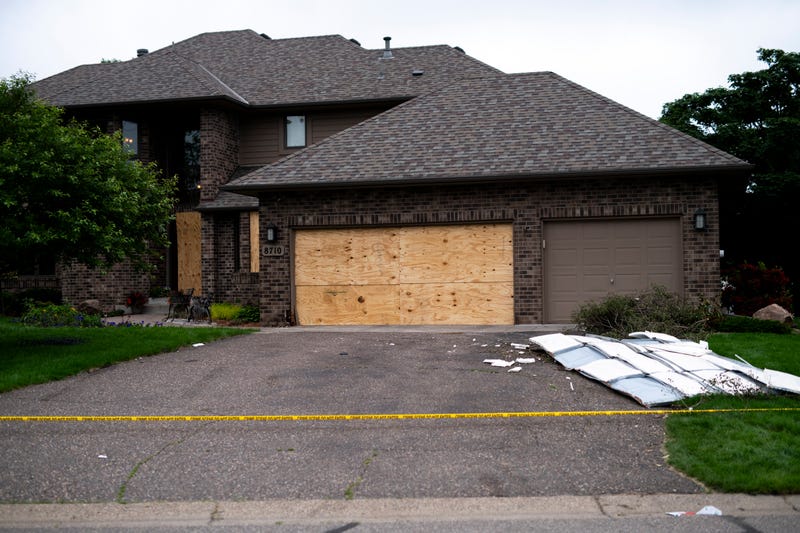Boards cover the doors and windows outside the home of DFL State Rep. Melissa Hortman on June 15, 2025 in Brooklyn Park, Minnesota.