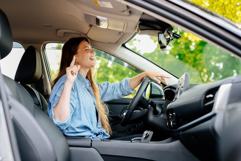 Woman singing in the car