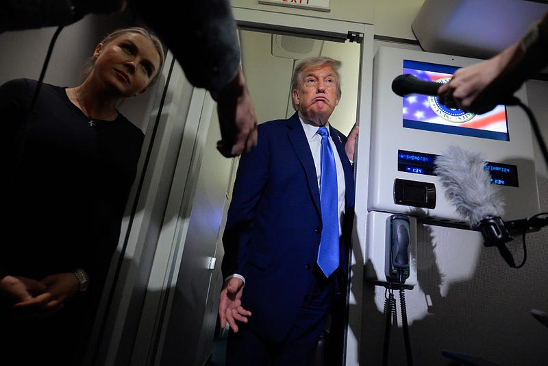 U.S. President Donald Trump talks to reporters on board Air Force One with White House Press Secretary Karoline Leavitt after leaving early from the G7 Leaders' Summit on June 16, 2025 in Calgary, Alberta