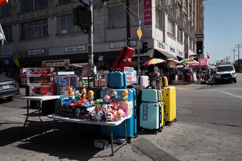 A vendor sells merchandise in the Santee Alley area of the Fashion District on June 19, 2025 in Los Angeles, California