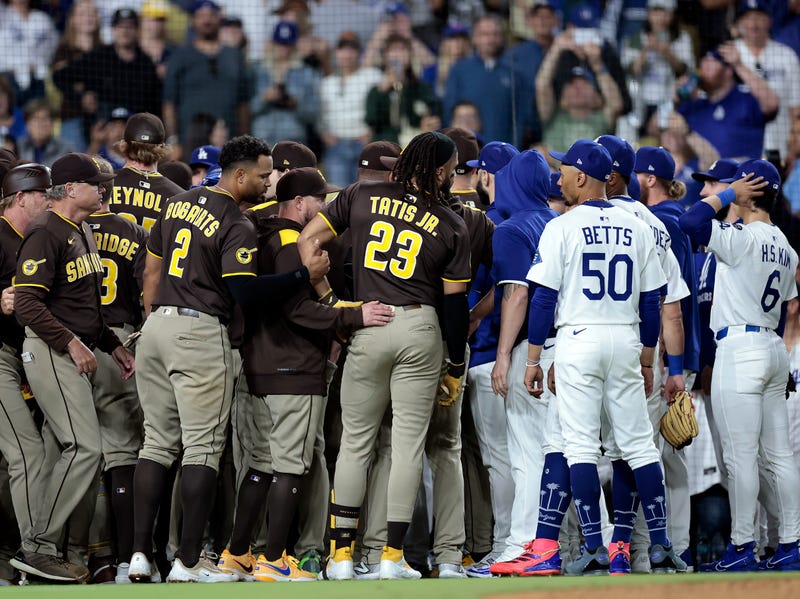 Fernando Tatis Jr. #23 of the San Diego Padres and Mookie Betts #50 of the Los Angeles Dodgers after the benches cleared due to Tatis Jr. being hit by a pitch in the ninth inning at Dodger Stadium on June 19, 2025
