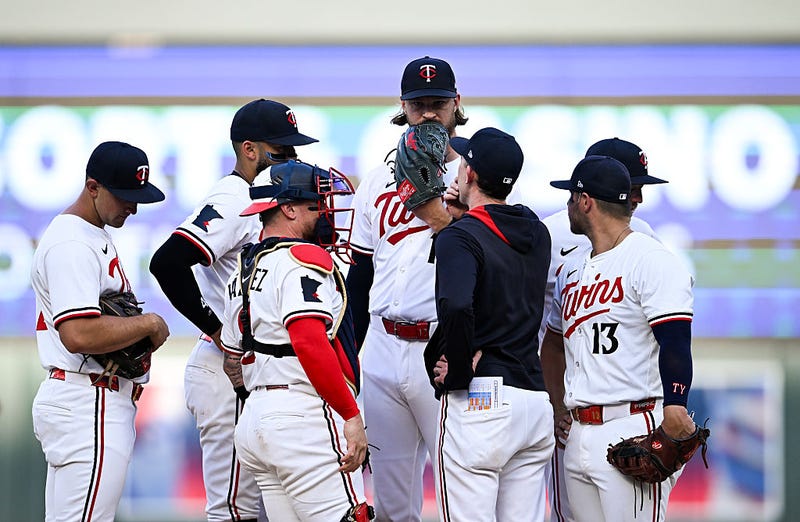 Pitching coach Pete Maki #88 of the Minnesota Twins visits Bailey Ober #17 on the mound in the third inning of the game against the Seattle Mariners at Target Field on June 23, 2025 in Minneapolis, Minnesota.